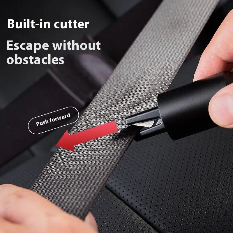 Aluminium alloy vehicle emergency window breaker tool with test glass on a table.