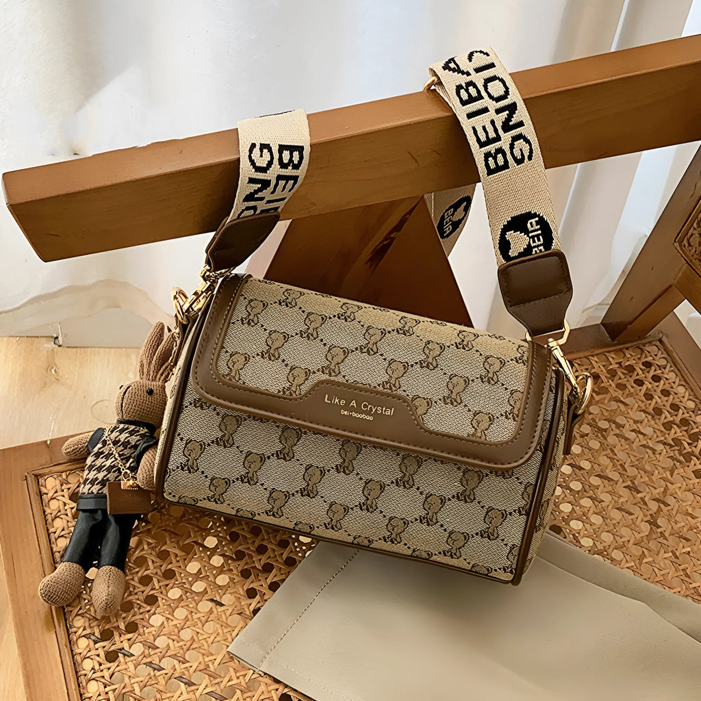 Khaki canvas square shoulder bag with cute bear design, woven letter and stitching details, 21x13x10cm
