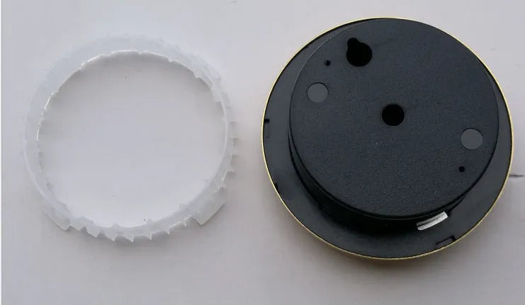 Circular aluminium analogue thermometer and hygrometer with temperature and humidity dials.