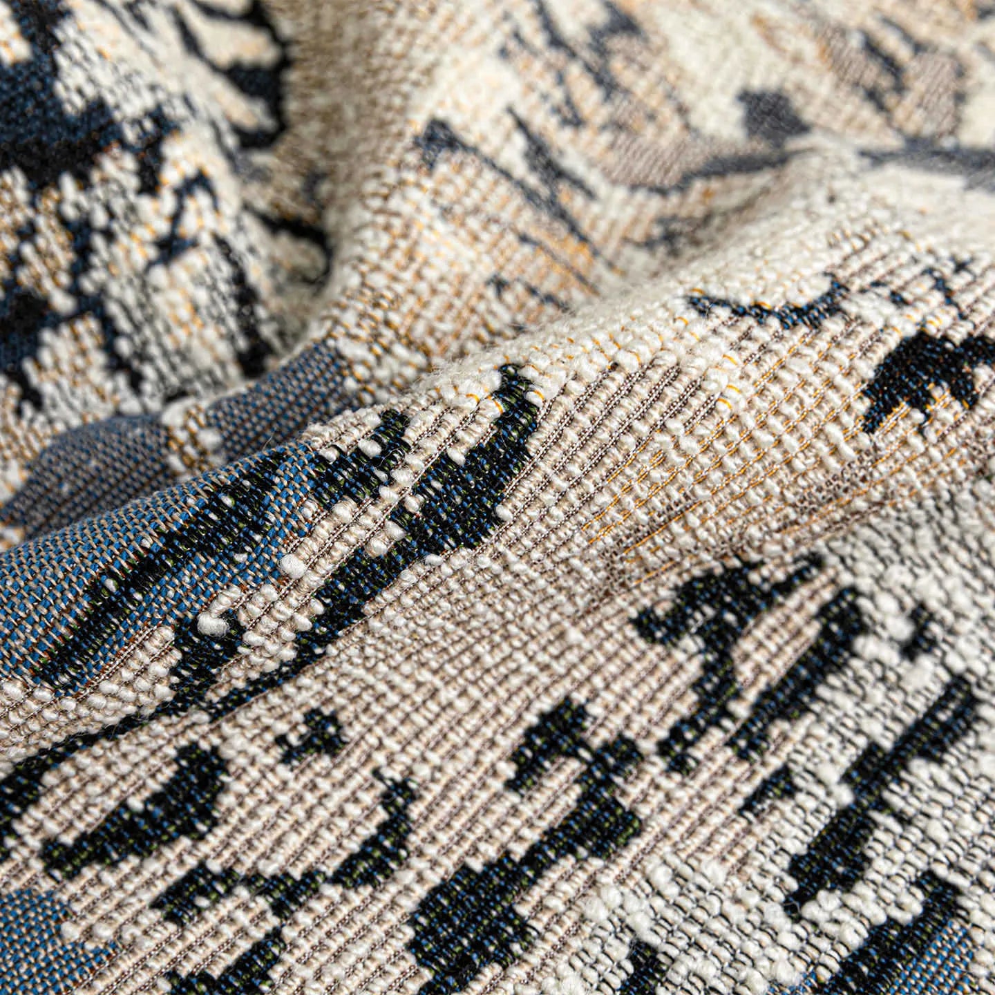 Chinese style antique blue floral pattern decorative cushion with wool blend cover on a sofa.