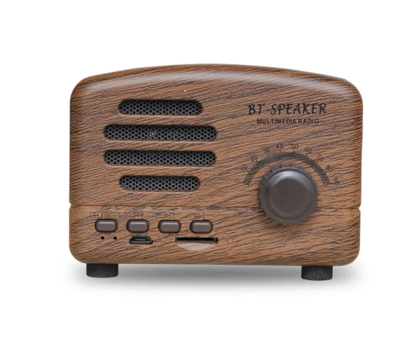 Compact Bluetooth speaker with wood grain finish, showing front grill and control buttons.