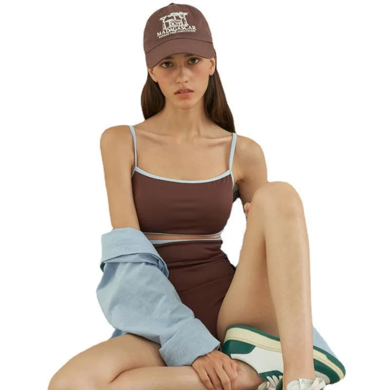 Brown triangle style one-piece swimsuit for women on a hanger