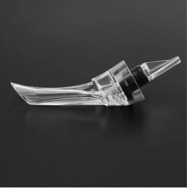 Compact clear acrylic wine aerator with a stainless steel filter inside, measuring 16cm.