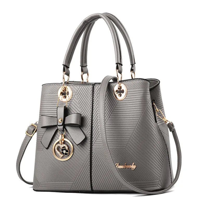 Retro PU handbag with zip closure and shoulder strap in multiple colours.