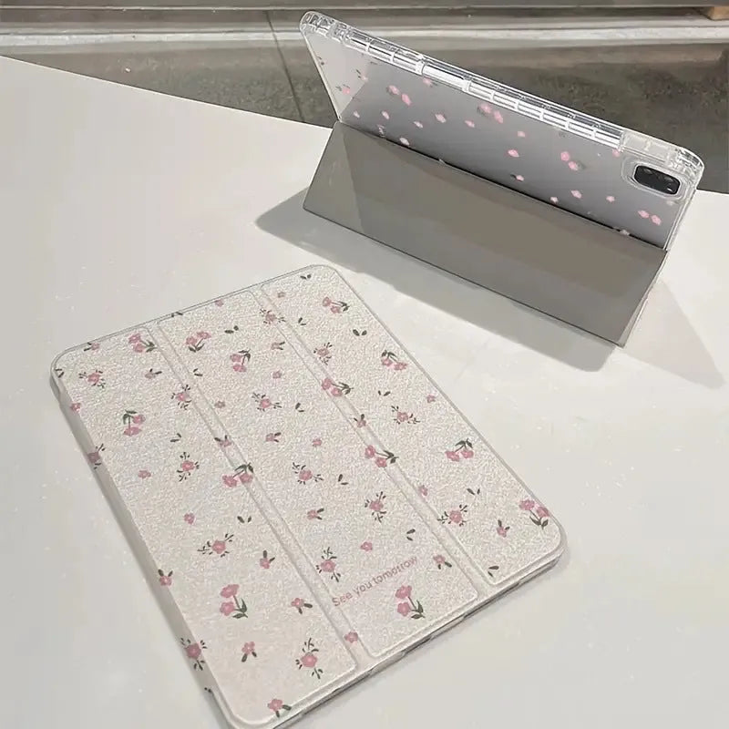 Transparent floral tri-fold iPad protective case showing magnetic stand function and cartoon design