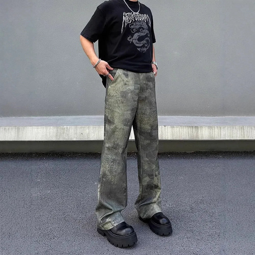Men's straight-cut camouflage print denim jeans on a white background.