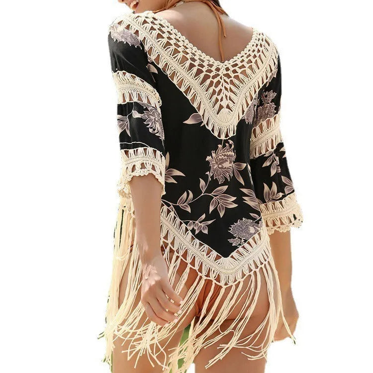 Women's apricot sun protection shirt with V-neck and hollow-out sleeves on a hanger.
