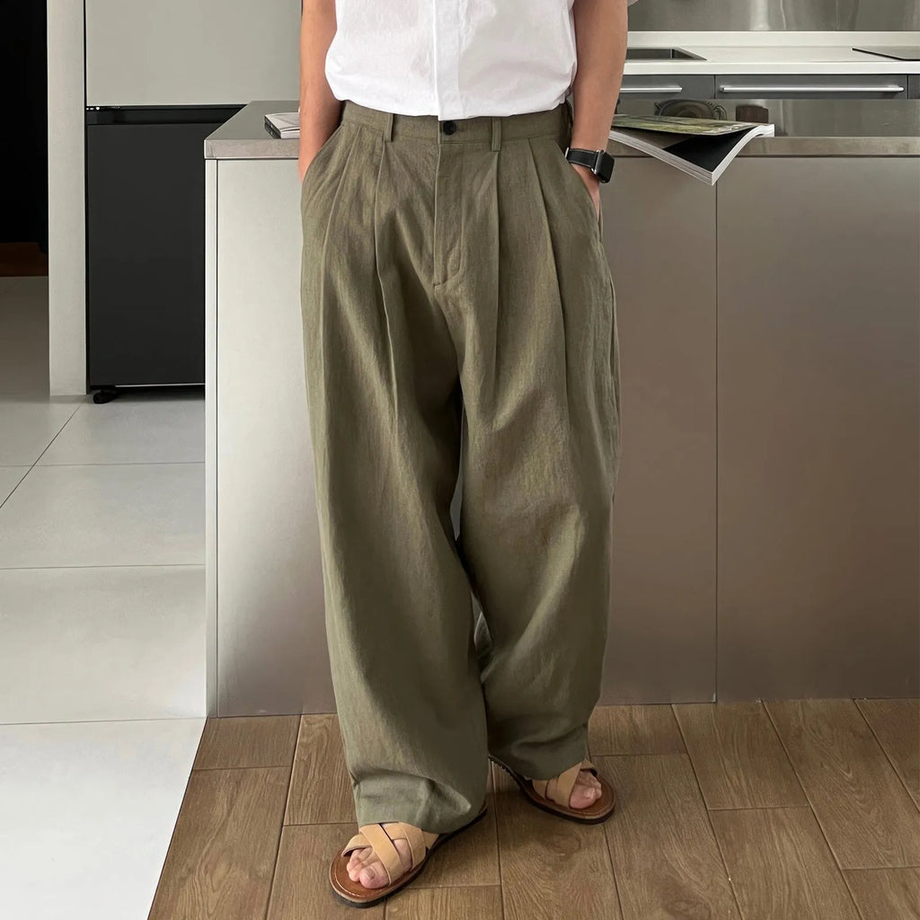 Army green men's casual drawstring waist trousers laid flat, showing the basic style and relaxed fit.