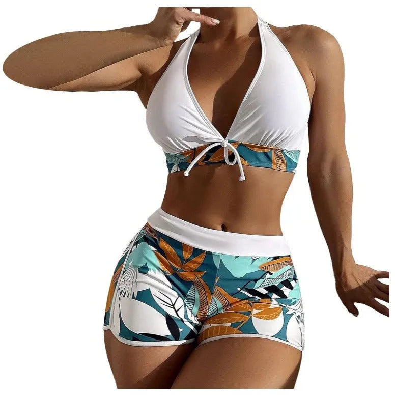 Women's solid colour white split top swimsuit with leaf print boxers bottoms, backless, sleeveless, polyester fabric