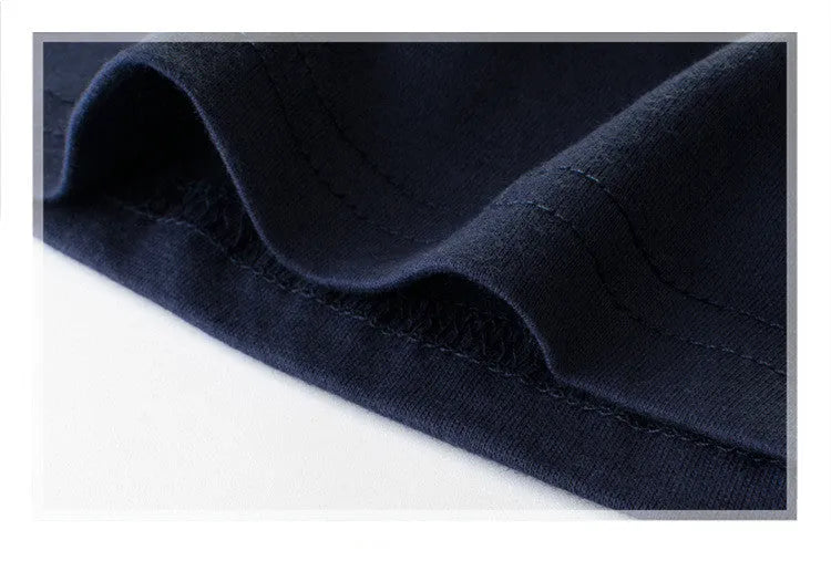 Boys' royal blue short sleeve cotton T-shirt shown on a hanger.