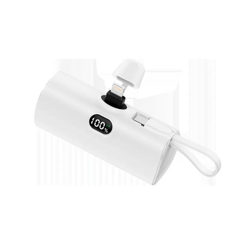 Compact capsule-shaped wireless power bank with digital display and integrated plug in multiple colours.