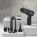 Black wireless handheld vacuum cleaner with attachments for car and home use.