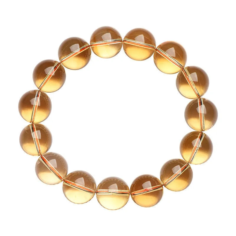 Natural citrine scattered beads ball bracelet on wrist, showing polished beads in 7A grade colour.