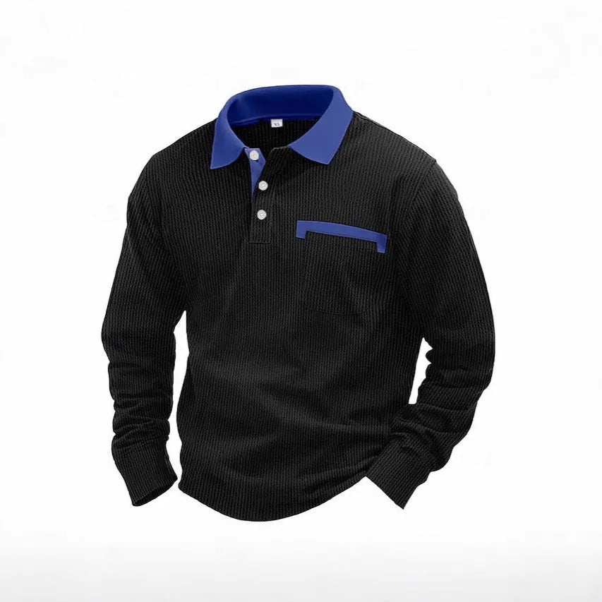 Man wearing a long-sleeved waffle-textured polo shirt in a loose fit, shown in a dark colour.