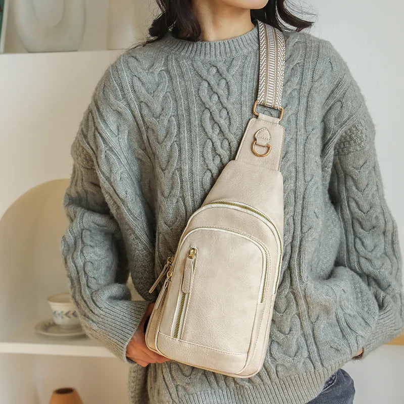 Soft brown PU leather women's crossbody chest bag with an open front pocket.