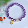 A women's bracelet with purple 8mm amethyst crystal beads arranged in a geometric, national style design.