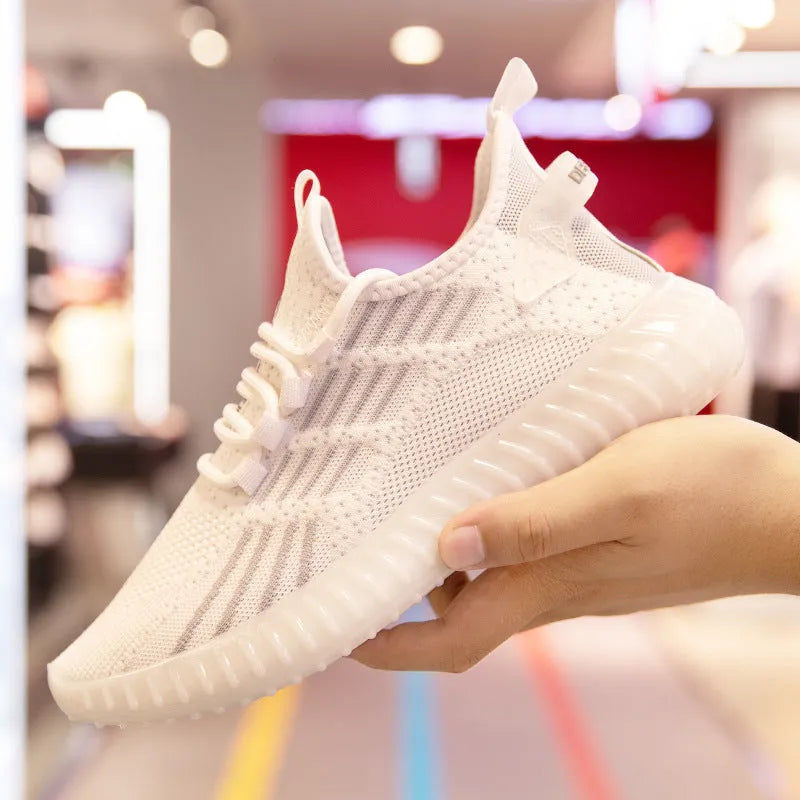 Men's white low-top platform sneakers with breathable fabric upper and round toe.