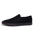 Canvas slip-on sneakers in khaki, grey green, or black with vulcanised rubber sole.