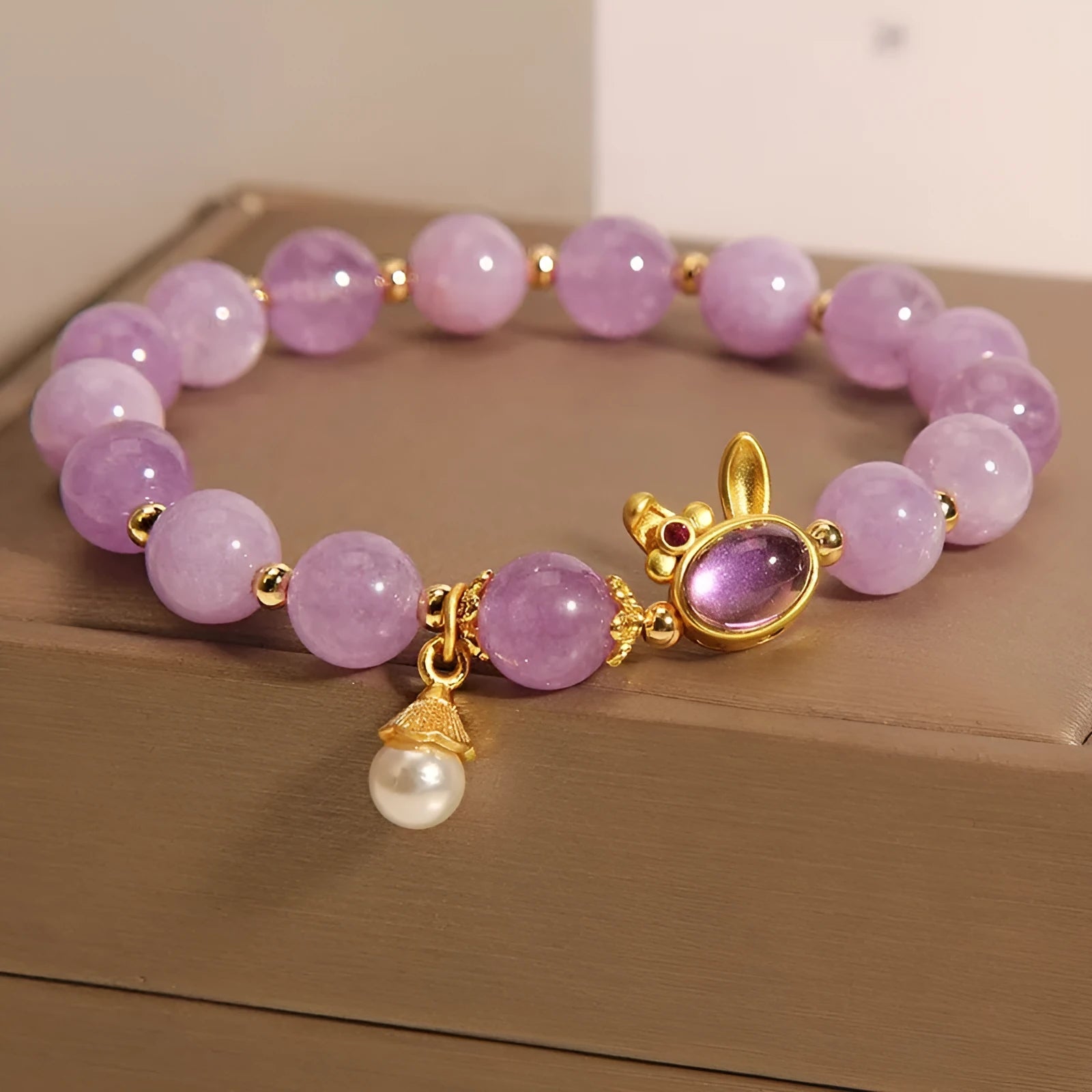 Natural mauve jade hare head crystal bracelet in Mori style with purplish red accents.