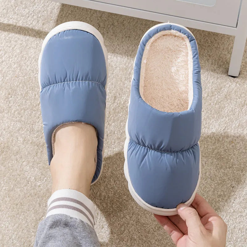Blue down cotton slippers with thick rubber sole and plush lining, shown from side.