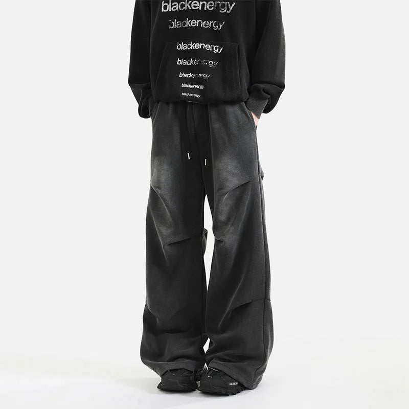 Men's pleated straight loose sweatpants in black and grey, cotton fabric, elastic waist, American washed finish.