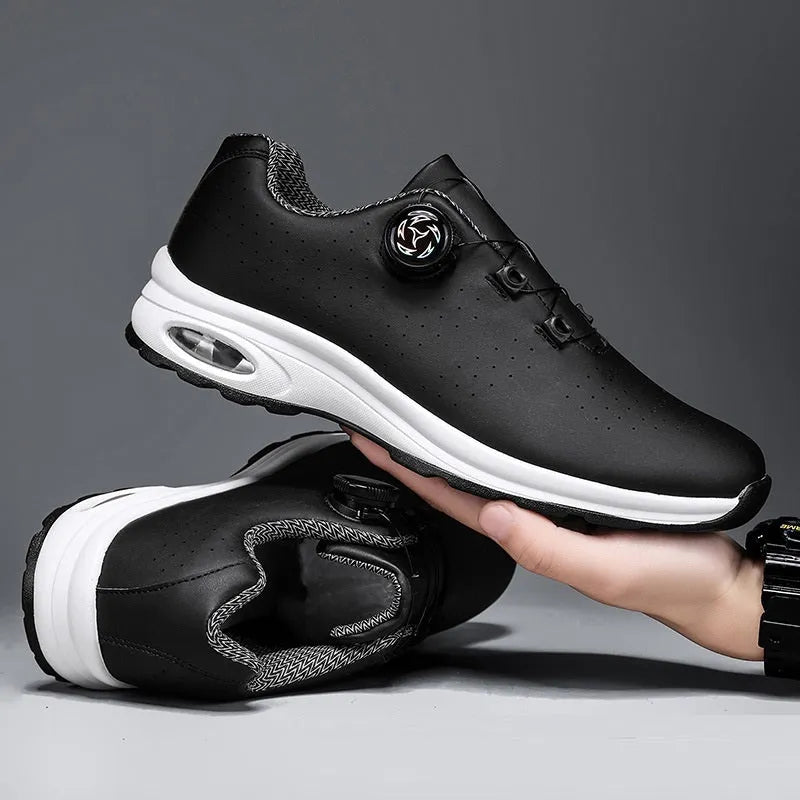 Men's black and white low-top mesh casual tennis shoes with lace-up front and cross straps.