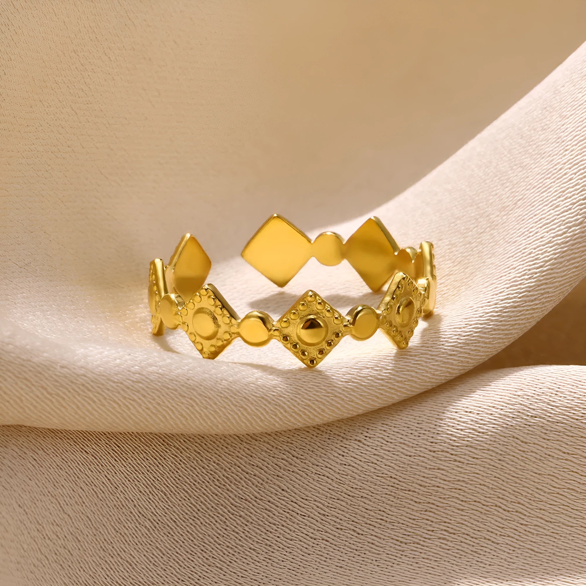 Gold diamond geometric titanium steel ring on a woman's hand.