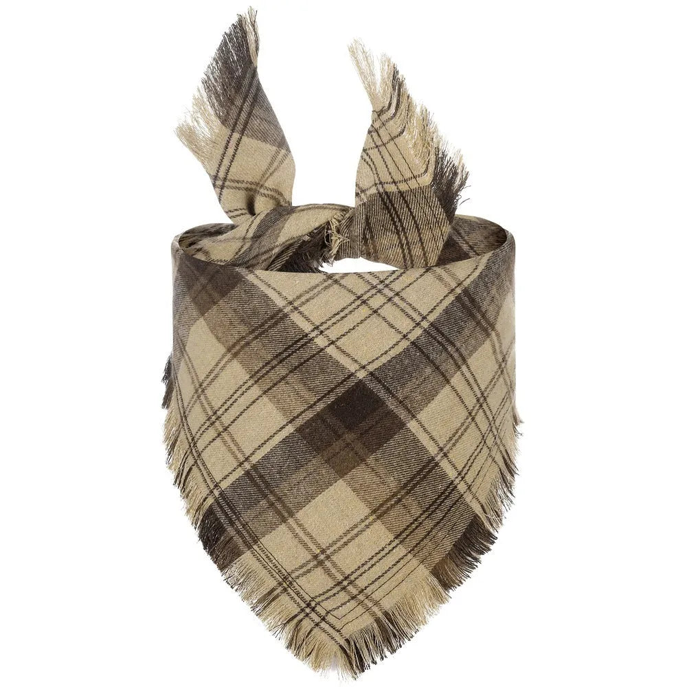 Plaid triangle dog bandana with tassels in autumn colours on a dog's neck.