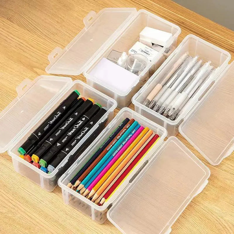 Transparent plastic pencil storage box showing organised drawing tools inside