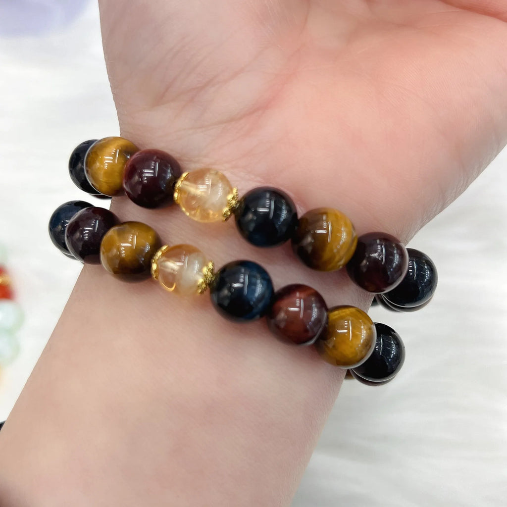 Brown tigereye stone round beads on Maillard chain bracelet showing natural banding patterns