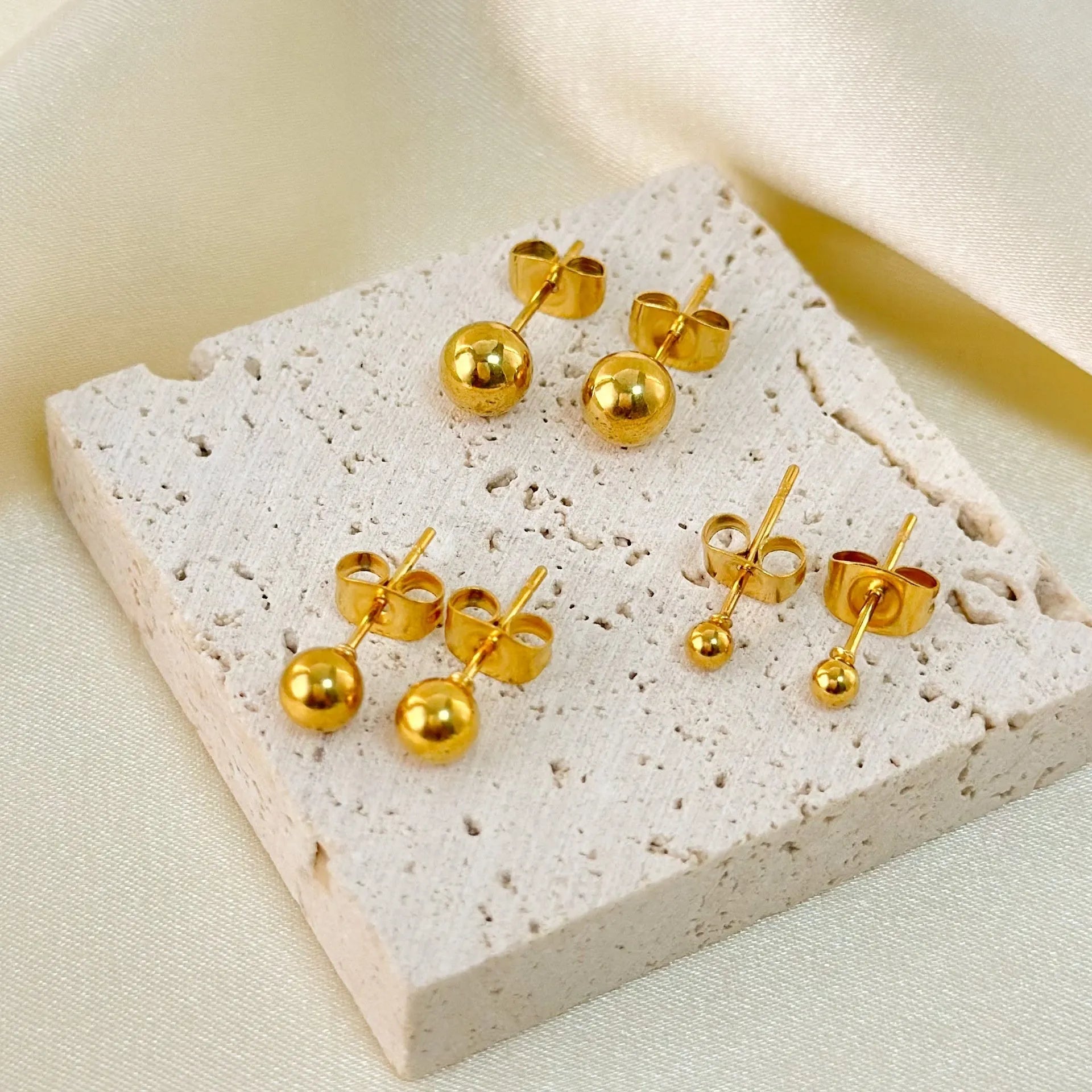 Stainless steel ball stud earrings with minimalist geometric design in gold or silver finish