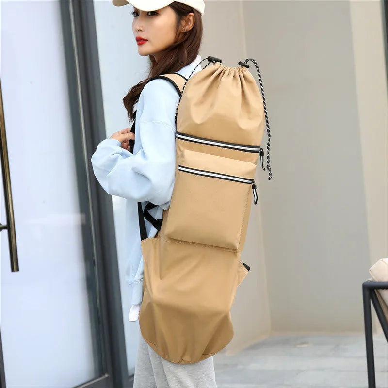Nylon skateboard backpack in black, shown with a longboard, featuring multiple pockets and adjustable straps.