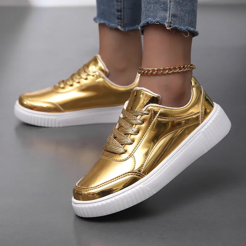 Rose gold sequin platform sneakers with round toe and thick sole.