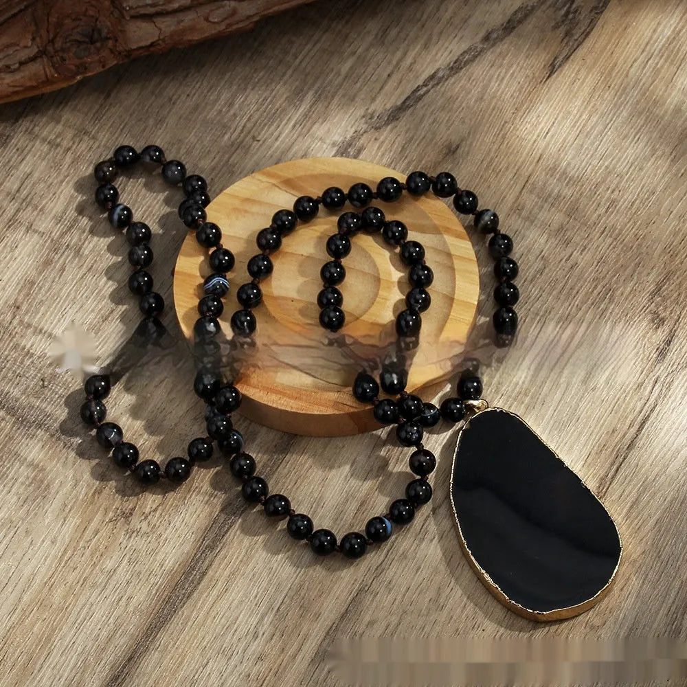 Bohemian handmade necklace with natural stone beads in brown, irregular agate pendant and knotted chain