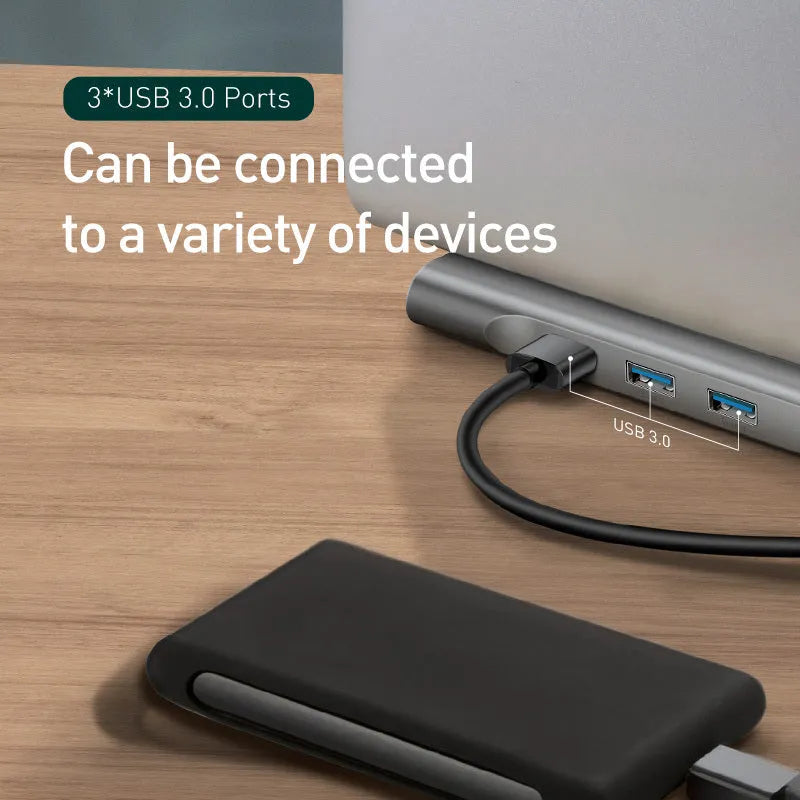 Grey 10-port USB-C docking station with aluminium cooling bracket showing HDMI, VGA, and Ethernet ports