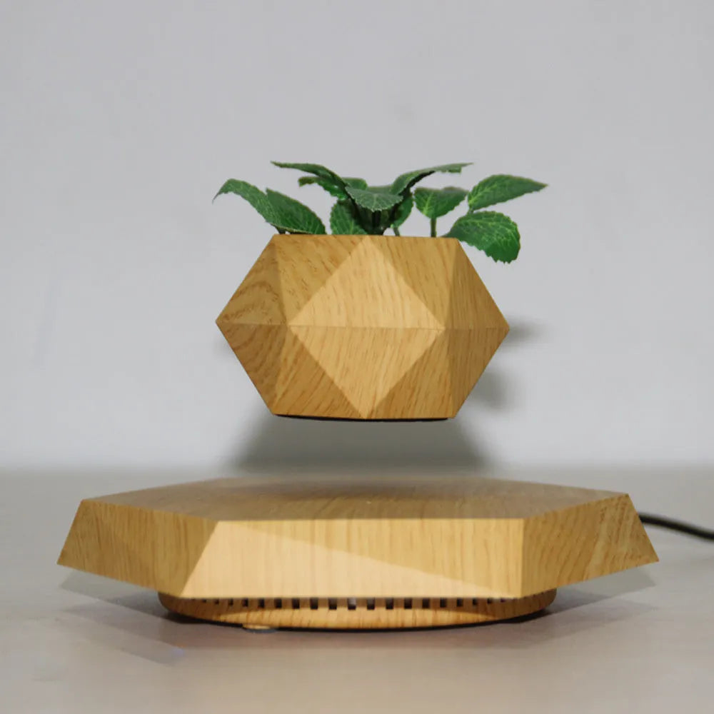 Hexagonal wood grain magnetic levitating flower pot floating above matching base