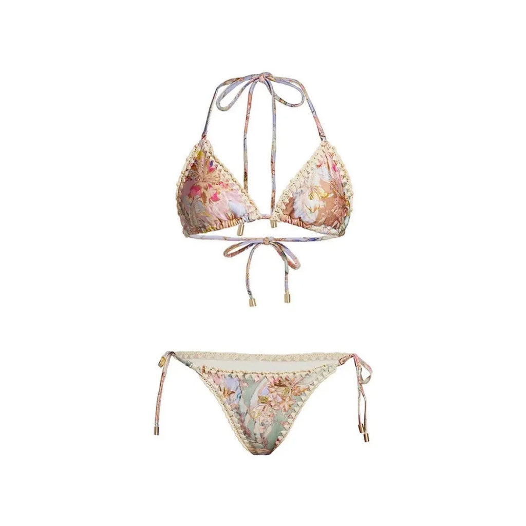 Women's creamy-white floral bikini set with separate skirt on beach