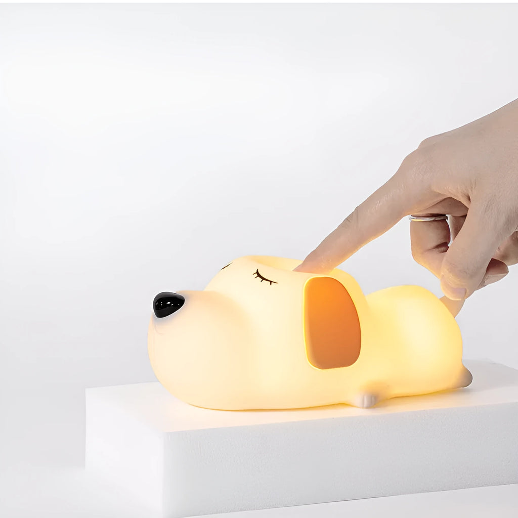 Cute two-tone cartoon dog silicone night lamp with USB cable for charging.