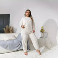 Women's creamy white plush two-piece casual set with crew neck top and matching trousers