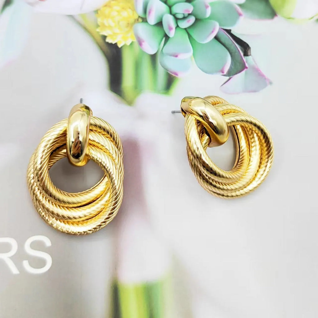Gold geometric ring embossed twisted stud earrings with exaggerated creative design on metal