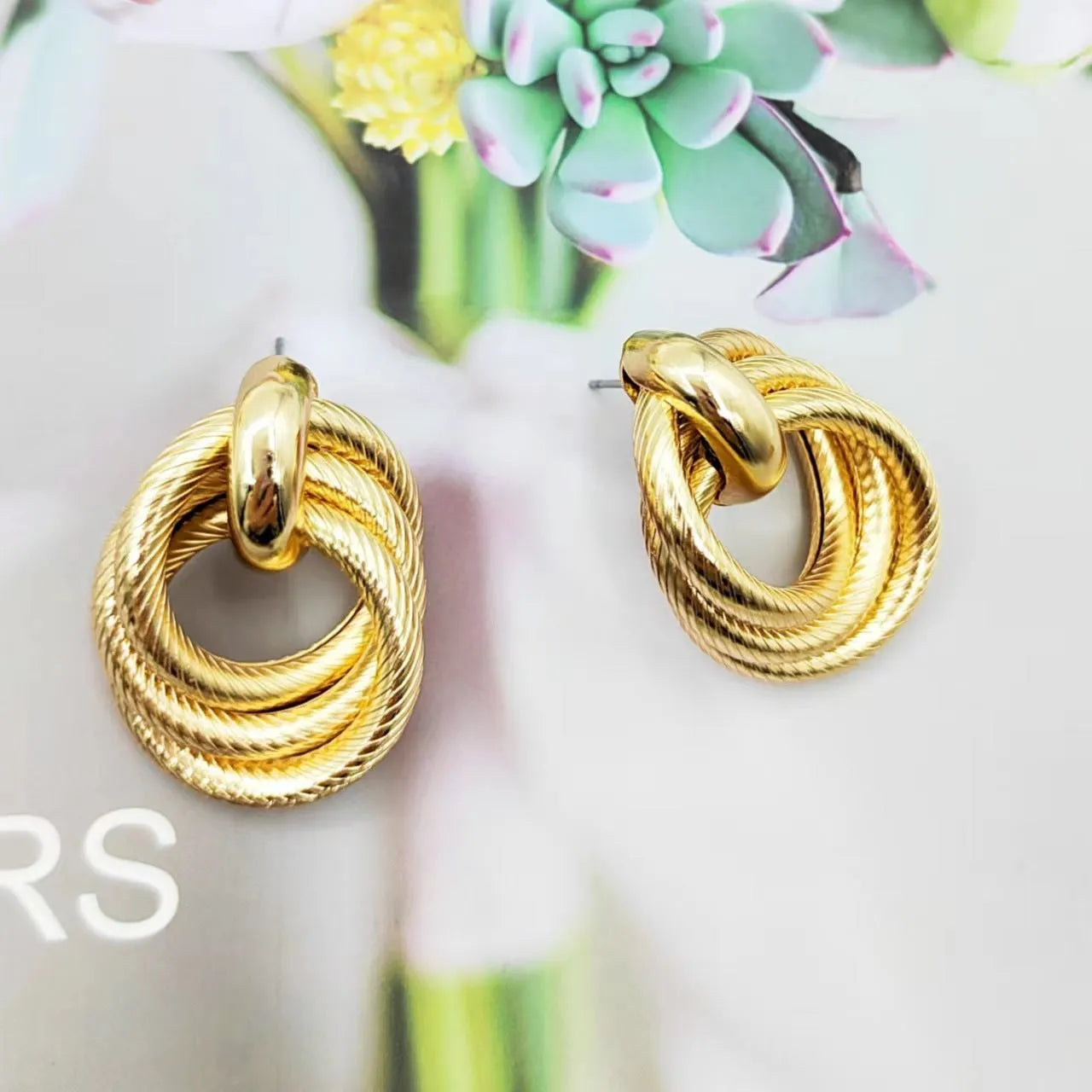 Gold geometric ring embossed twisted stud earrings with exaggerated creative design on metal