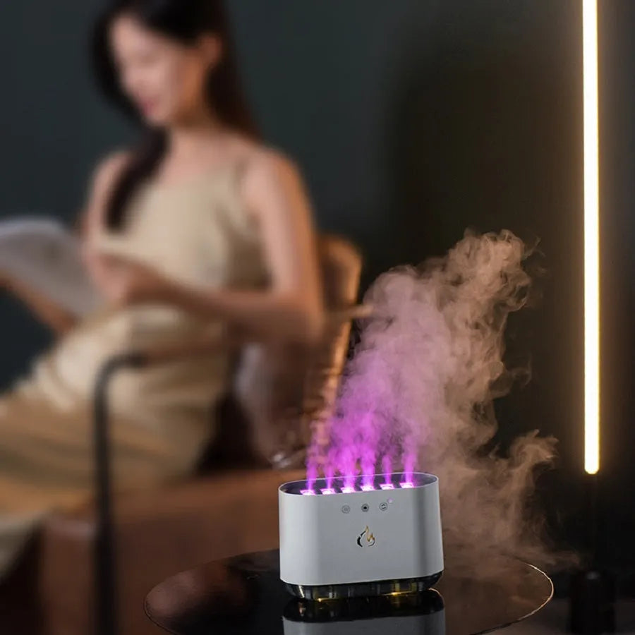 White large-capacity household humidifier with colourful LED light and mist output.