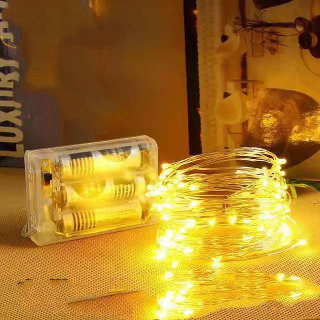 12-metre long copper wire LED string light with 120 small lamps, showing multiple colour options.