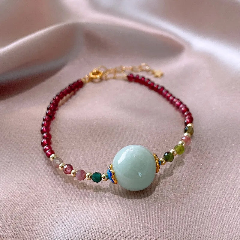 Garnet-coloured tourmaline drop bracelet in electroplated setting for women.