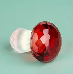 White crystal mushroom decorative sculpture in modern geometric style on a plain background.