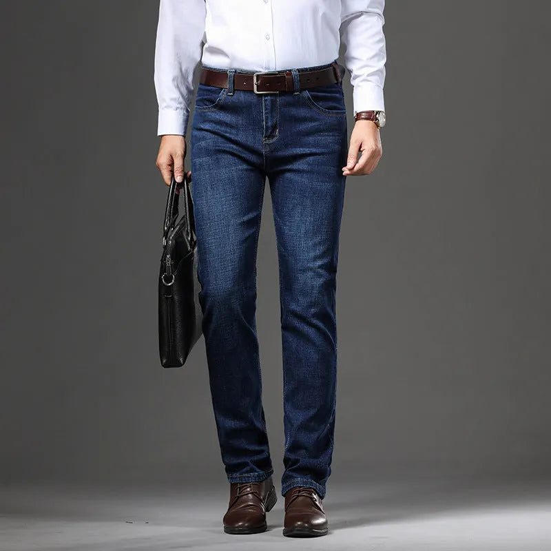 Straight leg stretch jeans in blue denim on a mid-waist model, showing zip fly and high elasticity fabric.