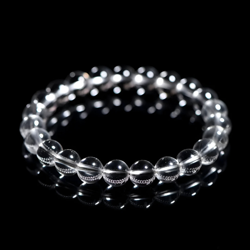 Natural Donghai old materials white crystal geometric bracelet with round beads on a wrist.