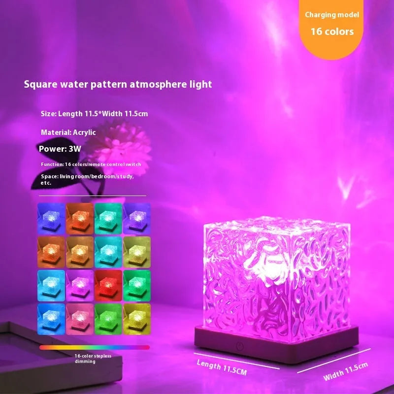 USB-powered crystal table lamp projecting blue water ripple light patterns on a wall