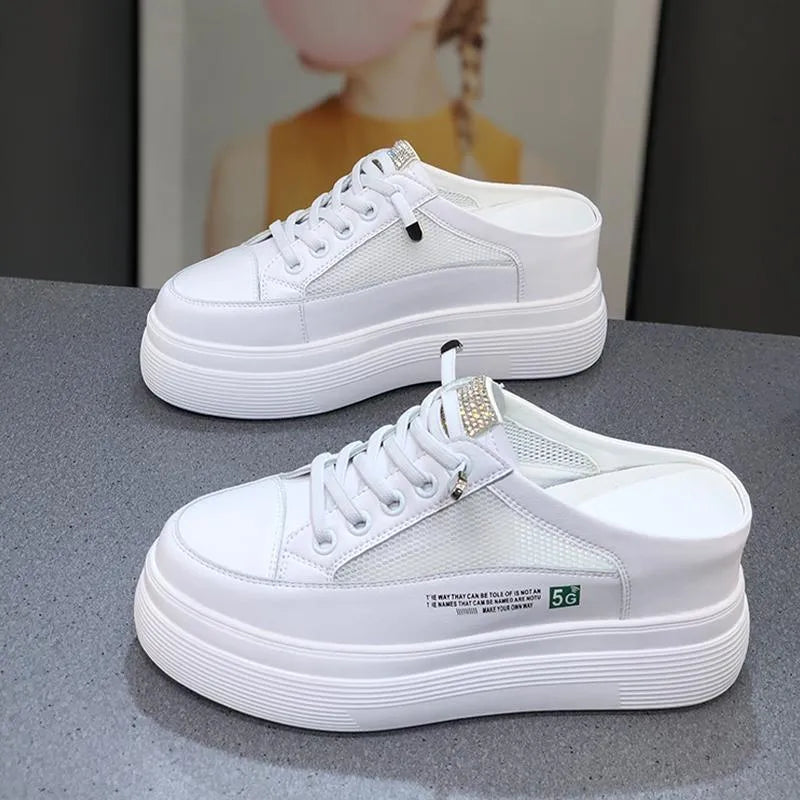 White women's casual platform shoes with mesh surface and heel-free design on a rubber sole.