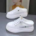 White women's casual platform shoes with mesh surface and heel-free design on a rubber sole.